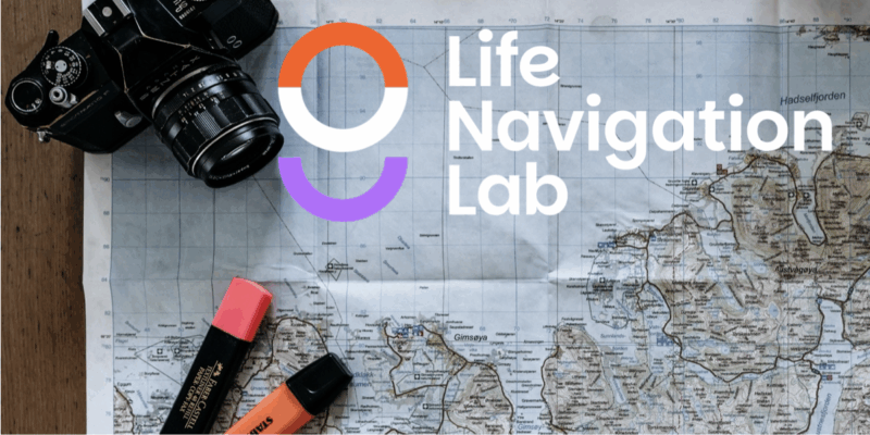 a map with highlighters and a camera sitting on top of it and the words 'Life Navigation Lab' with logo of a stylised compass in orange, white and lilac.