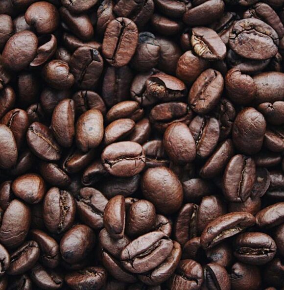 a close up image of roasted coffee beans